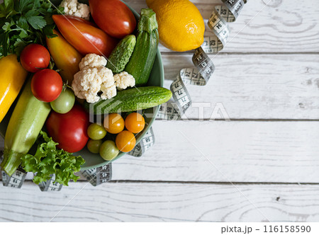 Large plate with various fresh farm vegetables. Autumn harvest and the concept of healthy organic food 116158590