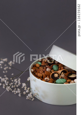 Peanuts in box. Gift to Women's Day (8 March), Women's Day. Mother's Day Valentines day. Festive round box. 116159182