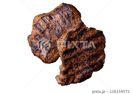 Fresh juicy delicious beef steak on a dark background Fresh juicy delicious beef steak on a dark background 116159572