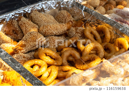 Seafood tempura on tray, various shapes, sizes. Battered, deep-fried shrimp, calamari, vegetables 116159638