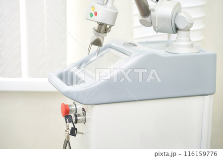 Face procedure device. Professional dermatologist uses modern technology laser 116159776