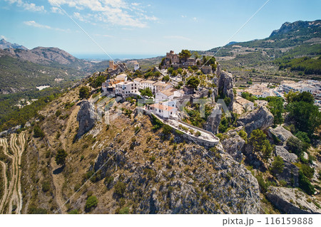Aerial photography Guadalest hilltop village surrounded mountains. Spain 116159888