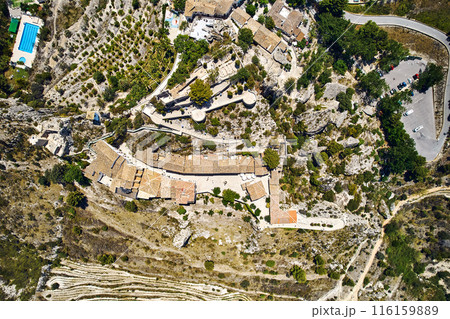 Aerial photography Guadalest hilltop village surrounded mountains. Spain 116159889