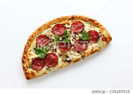 Petite pizza calzone on a white background Petite pizza calzone on a white background 116160518