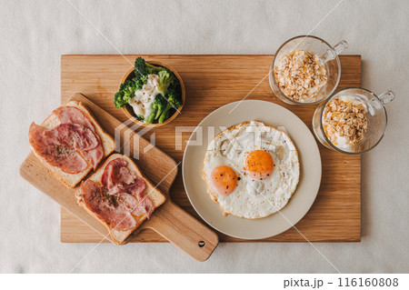 Easy breakfast set of ham fired eggs broccoli and yogurts. Easy breakfast set of ham fired eggs broccoli and yogurts. 116160808