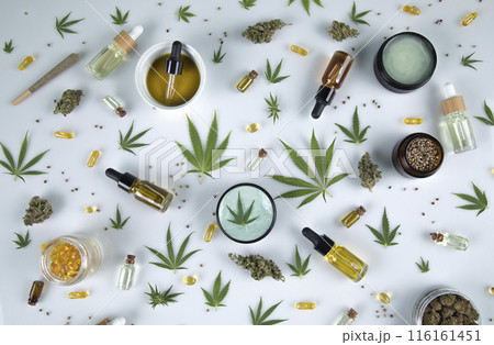 Bottles with hemp oil and cannabis leaves, marijuana on white background Bottles with hemp oil and cannabis leaves, marijuana on white background 116161451