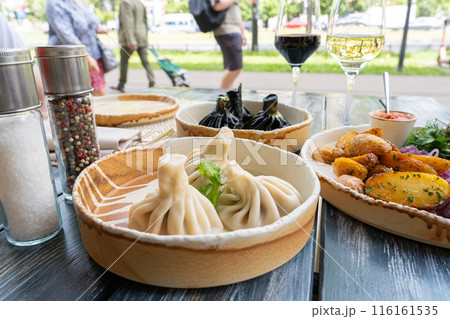 Georgian khinkali, minced meat chinkali, spicy dumplings also called dimsum, momo, jiaozi, manti Georgian khinkali, minced meat chinkali, spicy dumplings also called dimsum, momo, jiaozi, manti 116161535