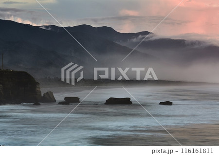 Ocean beach cliffs and mist in New Zealand Ocean beach cliffs and mist in New Zealand 116161811