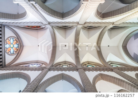 interior inside of Christian Catholic church with white ceilings. Sacred Heart of Jesus Cathedral in Tashkent interior inside of Christian Catholic church with white ceilings. Sacred Heart of Jesus Cathedral in Tashkent 116162257