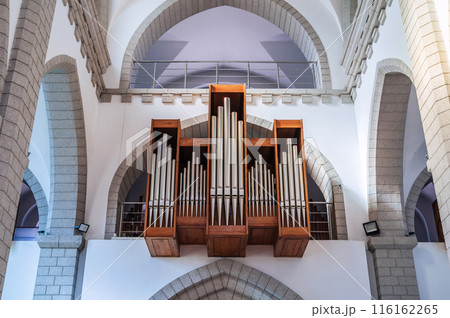 pipes of church organ inside interior of Christian Catholic church. Cathedral of the Sacred Heart of Jesus in Tashkent in Uzbekistan pipes of church organ inside interior of Christian Catholic church. Cathedral of the Sacred Heart of Jesus in Tashkent in Uzbekistan 116162265