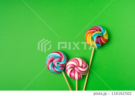 Color lollipop, spiral candy on stick, colorful striped lollypop, round fruit caramel, circle lollipop 116162502