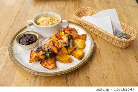 Poultry Shish Kebab, Barbecue Shashlik with Meat and Vegetables, Fruits, Peppers, Onions and Pineapple Poultry Shish Kebab, Barbecue Shashlik with Meat and Vegetables, Fruits, Peppers, Onions and Pineapple 116162547