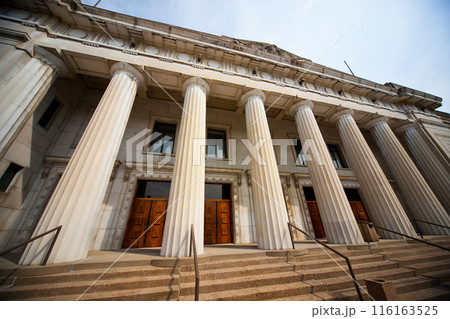 Daytime View of Neoclassical Building with Tall Columns and Stone Steps Daytime View of Neoclassical Building with Tall Columns and Stone Steps 116163525