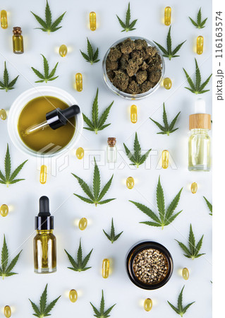 Hemp oil and cannabis leaves, marijuana on white background Hemp oil and cannabis leaves, marijuana on white background 116163574