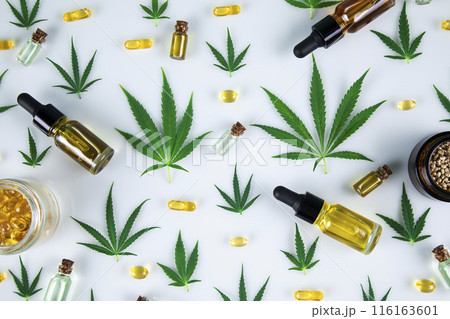 Composition, hemp oil, cannabis leaves, marijuana, Flat lay on white background Composition, hemp oil, cannabis leaves, marijuana, Flat lay on white background 116163601