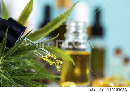 Hemp oil and marijuana leaves on extract cbd Hemp oil and marijuana leaves on extract cbd 116163688