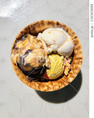 Colorful Ice Cream Scoops in Waffle Bowl, High-Angle View Colorful Ice Cream Scoops in Waffle Bowl, High-Angle View 116163689
