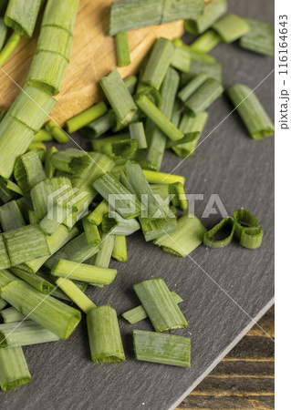 green onions on the table during cooking green onions on the table during cooking 116164643