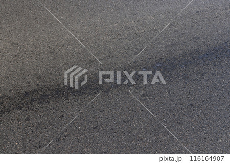 white road markings on asphalt, close up white road markings on asphalt, close up 116164907