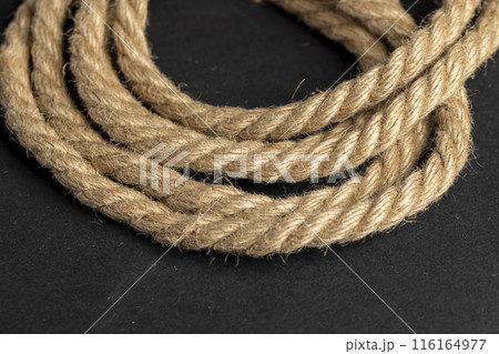 a close-up of a piece of rope for industrial use a close-up of a piece of rope for industrial use 116164977