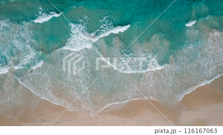 Aerial view drone over beach sea. Beautiful sea waves. Beach sand and amazing sea in Dominican Republic. Aerial view drone over beach sea. Beautiful sea waves. Beach sand and amazing sea in Dominican Republic. 116167063