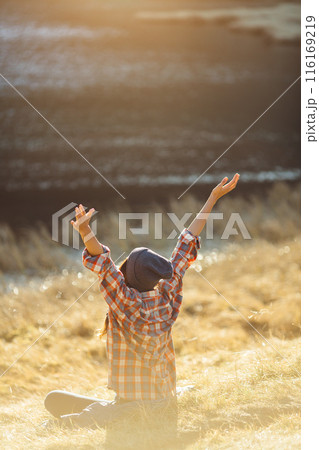 Woman Celebrating Near Nesamovyte Lake in Carpathian Mountains 116169219