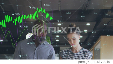 Image of multiple graphs with changing numbers over diverse coworkers discussing in office 116170010