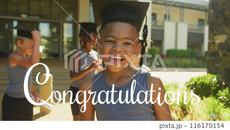 Image of congratulations text over happy biracial schoolboy in mortar board outside school 116170154
