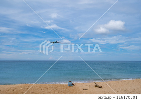 Airplane landing at Phuket airport Thailand,Flight over beach sea background 116170301