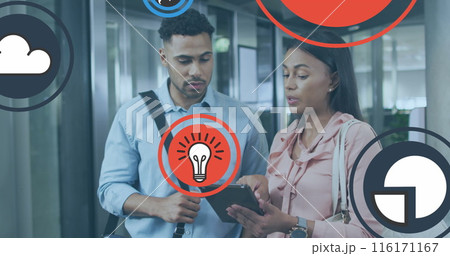 Image of icons over diverse coworkers discussing reports on digital tablet in office 116171167