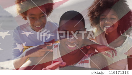 Image of flag of usa over african american couple with son taking selfie on vacation Image of flag of usa over african american couple with son taking selfie on vacation 116171318