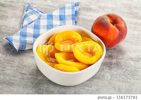 Ripe sweet and juicy canned peach 116173791