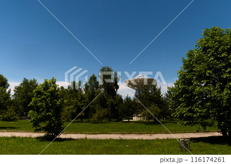Distant view of radio telescope dish Distant view of radio telescope dish 116174261