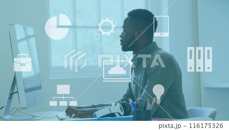 Image of multiple digital icons against african american man using a computer at office 116175326