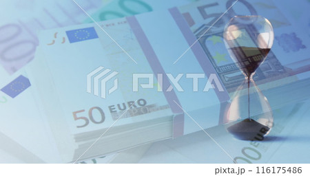 Image of euro currency banknotes over hourglass Image of euro currency banknotes over hourglass 116175486