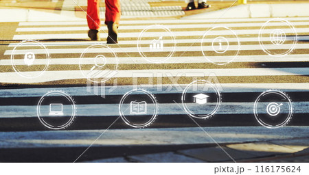 Image of multiple digital icons against low section of man crossing the street 116175624