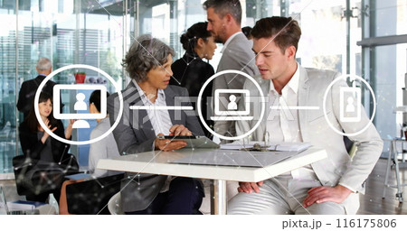 Image of network of icons over diverse businessman and businesswoman discussing at office Image of network of icons over diverse businessman and businesswoman discussing at office 116175806