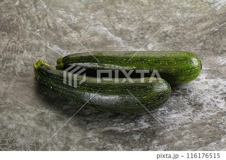 Raw young small green zucchini 116176515
