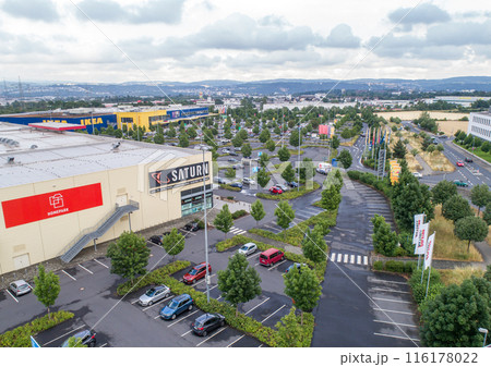 Koblenz, Germany, 11.07.2019 Aerial view Parking lot of Saturn and IKEA store against cloudy sky in Germany 116178022