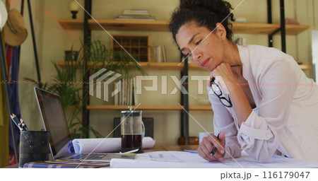 Image of financial data processing over biracial woman using taking notes Image of financial data processing over biracial woman using taking notes 116179047