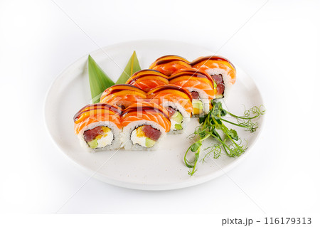 Fusion sushi roll with salmon and tuna on a plate, isolate 116179313