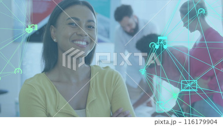 Image of icons connected with lines forming globes over smiling biracial woman Image of icons connected with lines forming globes over smiling biracial woman 116179904
