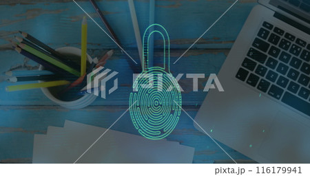 Laptop and school supplies are on wooden table 116179941