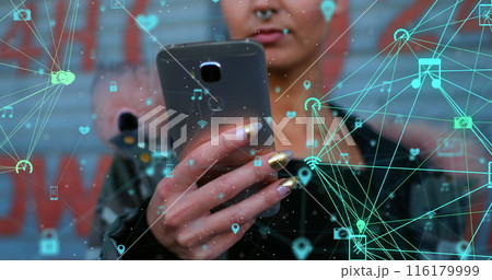 A young Caucasian professional holding smartphone, digital icons floating around 116179999