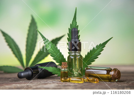 Hemp oil bottle with hemp leaf and cannabis leaf, marijuana Hemp oil bottle with hemp leaf and cannabis leaf, marijuana 116180208