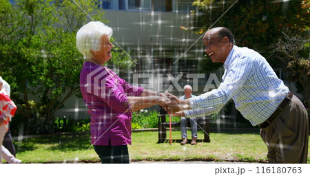 Image of light spots over diverse senior friends dancing 116180763