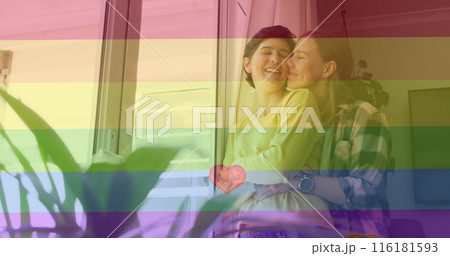 Image of heart emojis and rainbow flag over caucasian female couple embracing Image of heart emojis and rainbow flag over caucasian female couple embracing 116181593