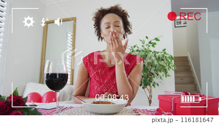 Image of image interface over african american woman having image call and holding flowers 116181647