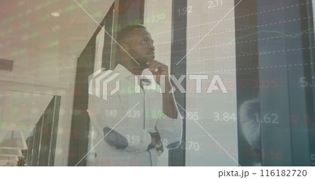 Image of multicolored trading board, thoughtful african american man looking through window Image of multicolored trading board, thoughtful african american man looking through window 116182720