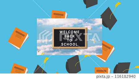 Graduation hat and book icons falling over back to school text on wooden slate on blue background 116182940